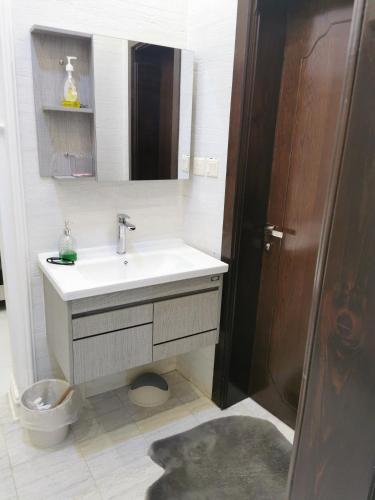 a bathroom with a sink and a toilet at راحتي in Al Baha