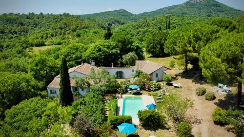an aerial view of a house with a swimming pool at Mas Les Micocouliers in Saint-Christol-lès-Alès
