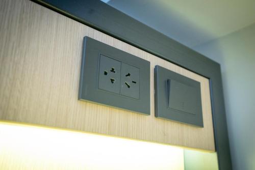 two switches on a wall in a room at America Del Sur Hostel Buenos Aires in Buenos Aires