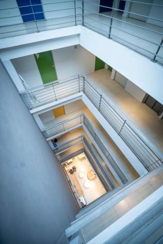 an overhead view of an empty room with a staircase at America Del Sur Hostel Buenos Aires in Buenos Aires