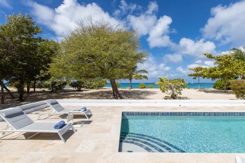 an image of a swimming pool at a villa at Blue Horizon Beach Bungalow in Baie Longue