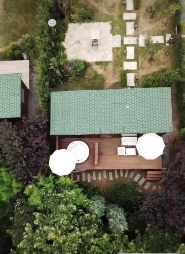 an overhead view of a house with a green roof at Pamera Garden Hotel in Kılıçlı