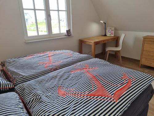 Postel nebo postele na pokoji v ubytování Reethaus "Utkiek"