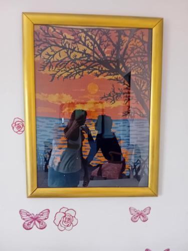 a picture of two people in a painting with butterflies at Private Villa AKOBARA, 2km from city center in Corfu Town
