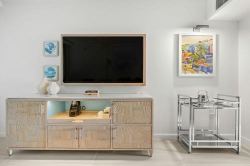 a entertainment center with a flat screen tv on a wall at La Concha Resort, Puerto Rico, Autograph Collection in San Juan