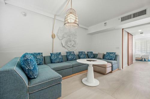 a living room with a couch and a table at La Concha Resort, Puerto Rico, Autograph Collection in San Juan