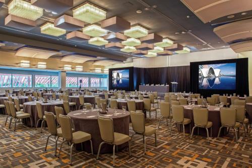 a large banquet hall with tables and chairs at La Concha Resort, Puerto Rico, Autograph Collection in San Juan