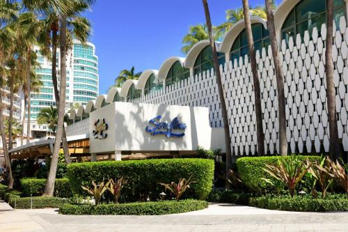a building with a sign on the side of it at La Concha Resort, Puerto Rico, Autograph Collection in San Juan