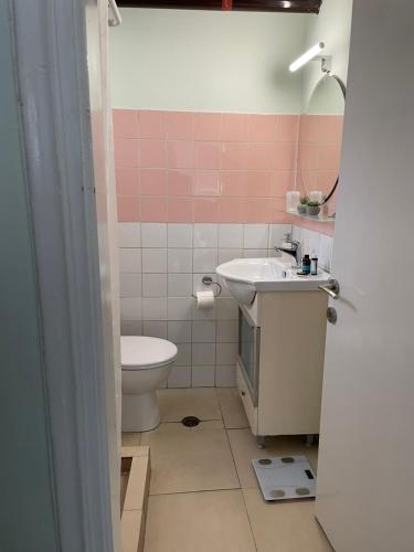 a bathroom with a sink and a toilet at Mediterranean house in Skala Sotiros