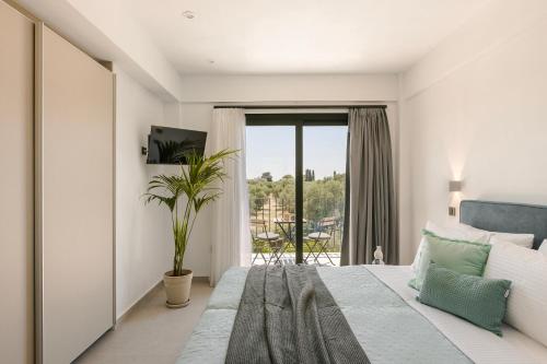 Ένα ή περισσότερα κρεβάτια σε δωμάτιο στο Kalyvakia Villas