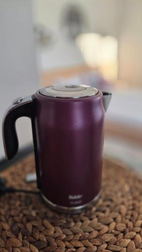 a purple cup sitting on top of a table at Social House Istanbul in Istanbul