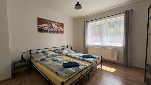 Postel nebo postele na pokoji v ubytování Ubytko u Karla