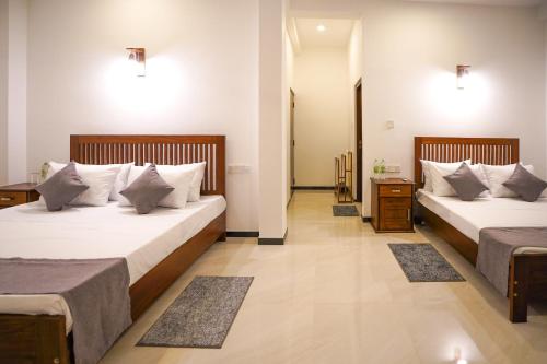 Cama o camas de una habitación en Cinnamon Forest Resort - Hikkaduwa