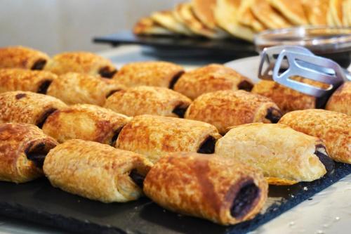 a bunch of donuts sitting on a tray withermott at Clube Porto Mos - Sunplace Hotels & Beach Resort in Lagos