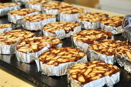 a bunch of cupcakes in tin foil on a tray at Clube Porto Mos - Sunplace Hotels & Beach Resort in Lagos