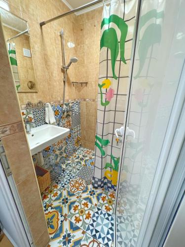 a bathroom with a shower and a sink at Blue Home in Burgas