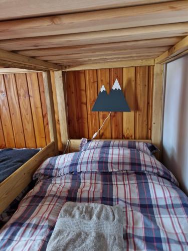 Postel nebo postele na pokoji v ubytování le chalet pointu de capucine