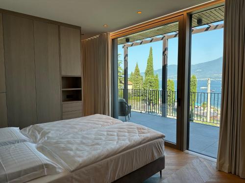 Giường trong phòng chung tại Luxury Apartments La Baia