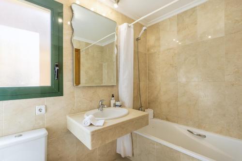 a bathroom with a sink and a bath tub at Floridamar in Jávea