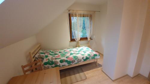 Ένα ή περισσότερα κρεβάτια σε δωμάτιο στο Panorama - Domy w Beskidach