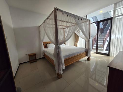Cama o camas de una habitación en Serenity Nirvana Palace - Jimbaran Hostel
