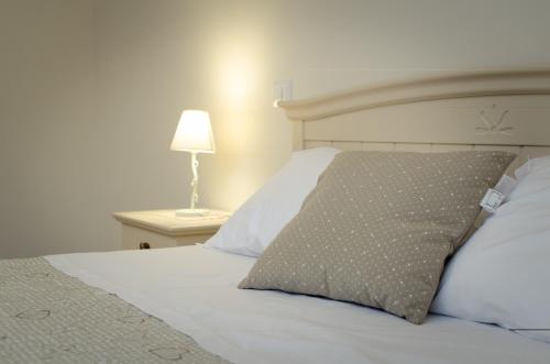 a bedroom with a bed with a pillow on it at Agriturismo Tenuta Umberto I in Ripacorbaria
