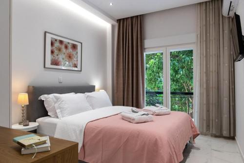 a hotel room with a bed and a window at THELIA Sofouli Urban Living in Thessaloniki