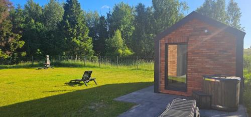 Κήπος έξω από το Domy pod lasem BANIA-SAUNA