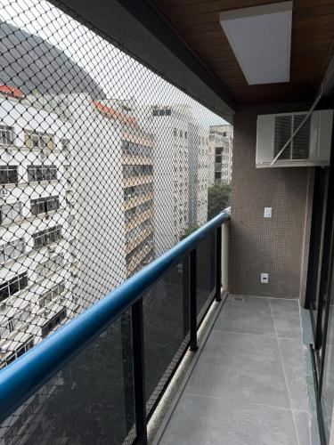 a balcony with a view of a building at Apartamento em Copacabana in Rio de Janeiro