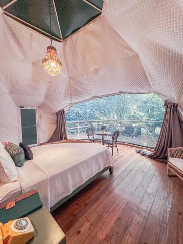 Katil atau katil-katil dalam bilik di River Glamping Boutique Jarabacoa