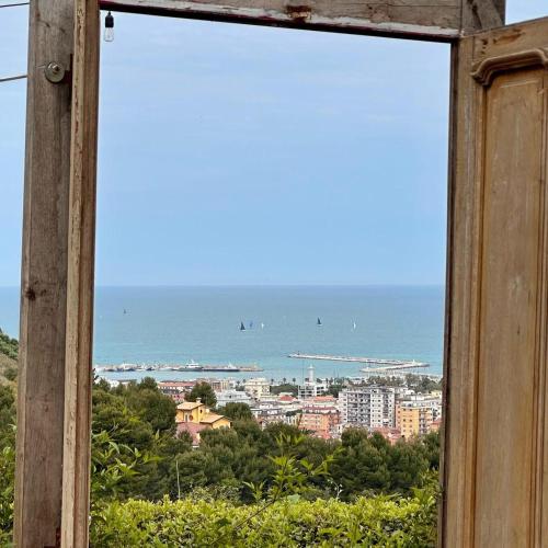a view of the ocean from a window at La Panoramica Country House in San Benedetto del Tronto