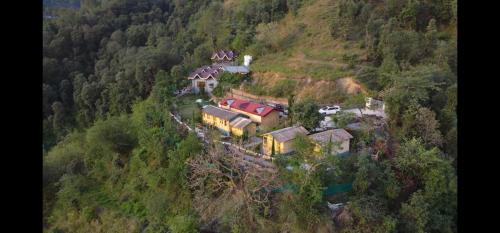 an aerial view of a house on a mountain at Lacasa Luxury Stays in Shogi
