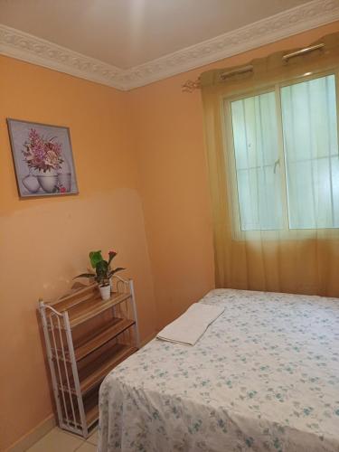 a bedroom with a bed and a window at Dona Beba Guesthouse in La Caleta