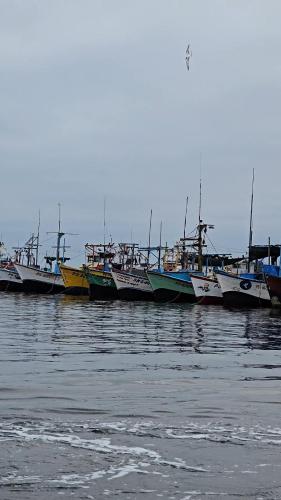 a group of boats sitting in the water at Hotel Riviera Inka Paracas in Paracas