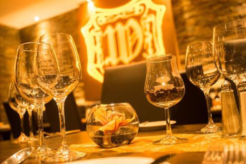 a group of wine glasses sitting on a table at Air Hotel Wartburg in Düsseldorf