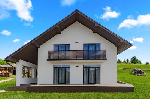 a rendering of a white house with a balcony at Smerichka in Bukovel