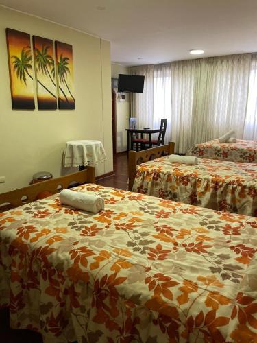 Postel nebo postele na pokoji v ubytování HOSPEDAJE LAS FLORES ICA