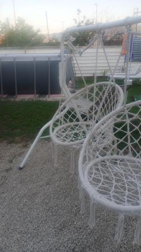 a white chair sitting on top of a playground at Green Garden da Virna 2 in Torre Annunziata
