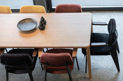 a table with chairs and a bowl on top of it at Villa Natura in Plešivica