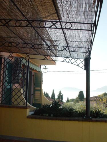 a view from the outside of a house with a pergola at Locanda Miranda in Tellaro