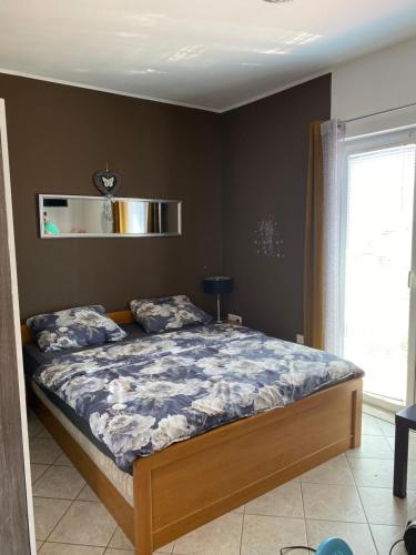a bedroom with a large bed in a room at Botic Apartments in Šilo
