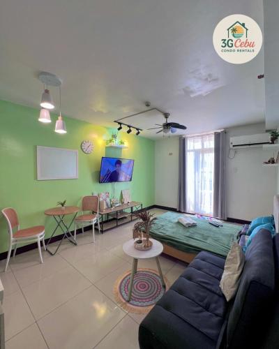 a living room with a couch and a table at 3G Cebu Condo Rental in Lo-oc