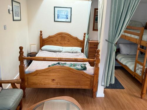 a bedroom with two bunk beds and a couch at Casa G in Bridlington