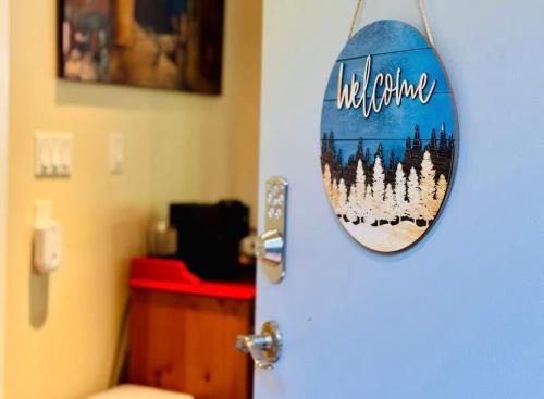 a bathroom door with a mirror on the door at Cliff House in West Vancouver