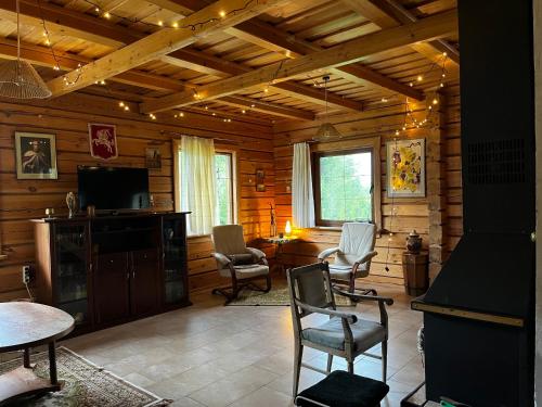 Posezení v ubytování Senovinis medinis namas - Gintaras