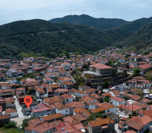 an aerial view of a city with houses and mountains at Casa Anastacia Sykia in Sikia