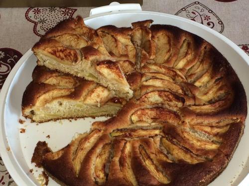 a pie on a white plate on a table at Agritur Maso Ciprianna B&B in Rabbi