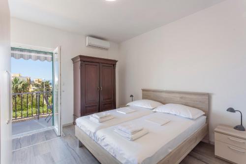 Ένα ή περισσότερα κρεβάτια σε δωμάτιο στο Apartmani Jurass