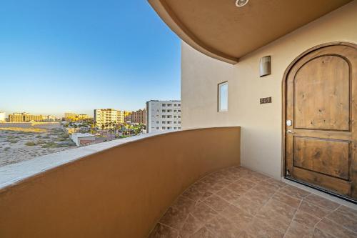 a door on the side of a building with a balcony at Bella Sirena 2BR 2BA 3rd Floor Ocean View B301 in Puerto Peñasco
