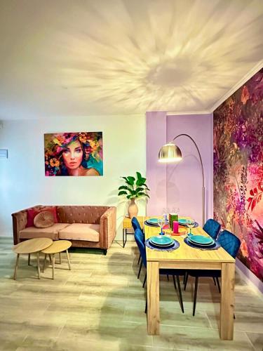 a living room with a table and a couch at BOUTIQUE LUXURY City Center in Alicante